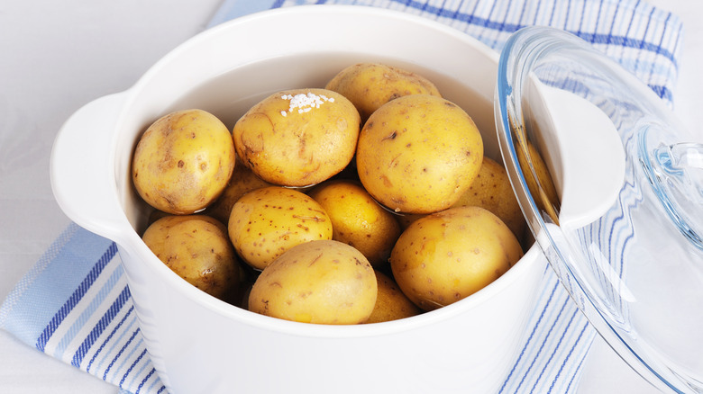 unpeeled potatoes in pot