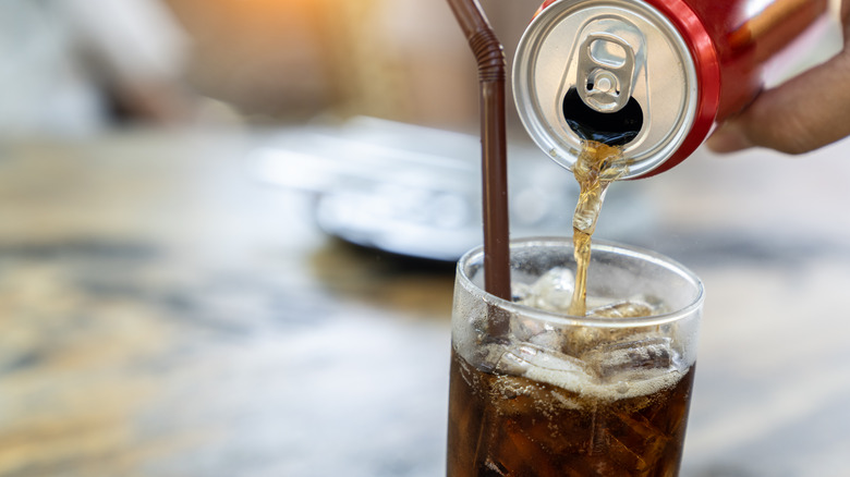 Soda being poured into a glass