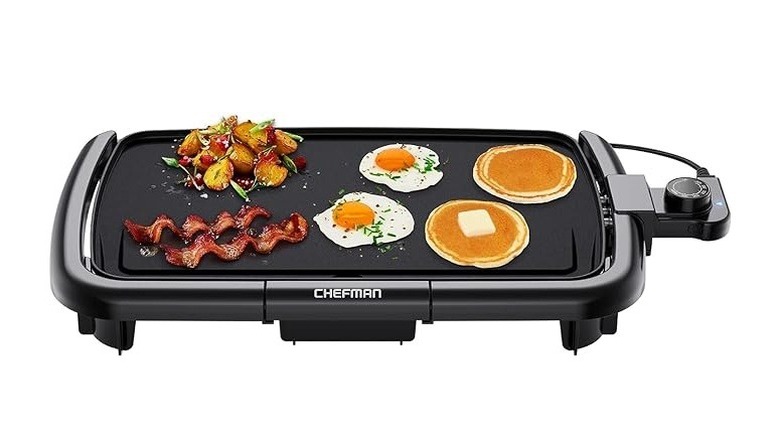 Chefman electric griddle with bacon, eggs, potatoes, and pancakes on top