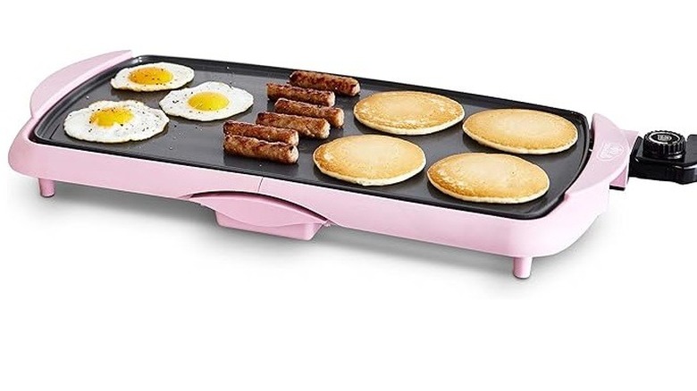 Greenlife Healthy Griddle in pink with eggs, sausage, and pancakes on top