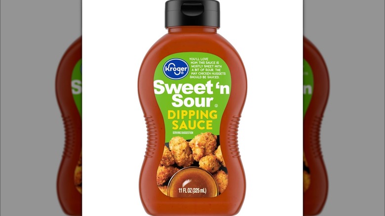 A red bottle of sweet n sour sauce with a green label