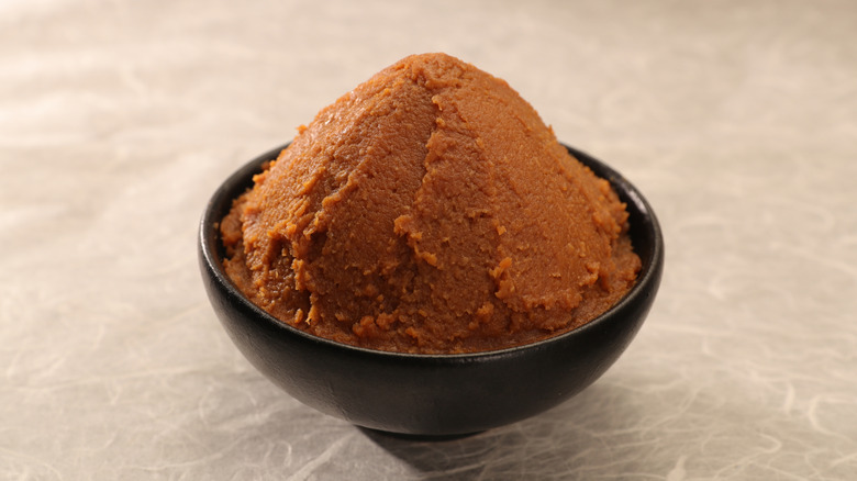 Black bowl filled with miso