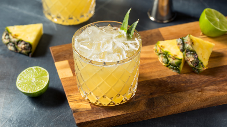 Pineapple margarita on wooden tray