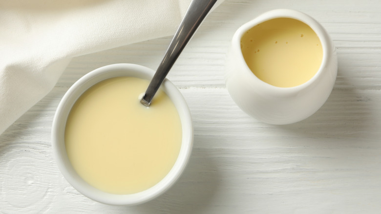 Condensed milk in pitcher and bowl