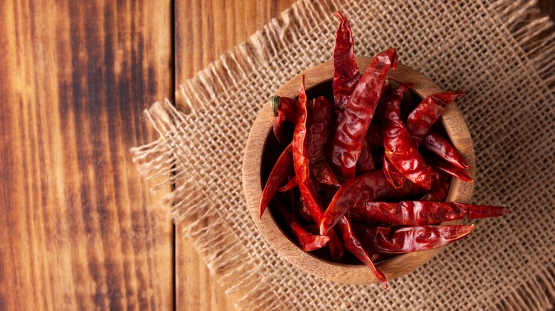 Wooden bowl of chiles de arbol