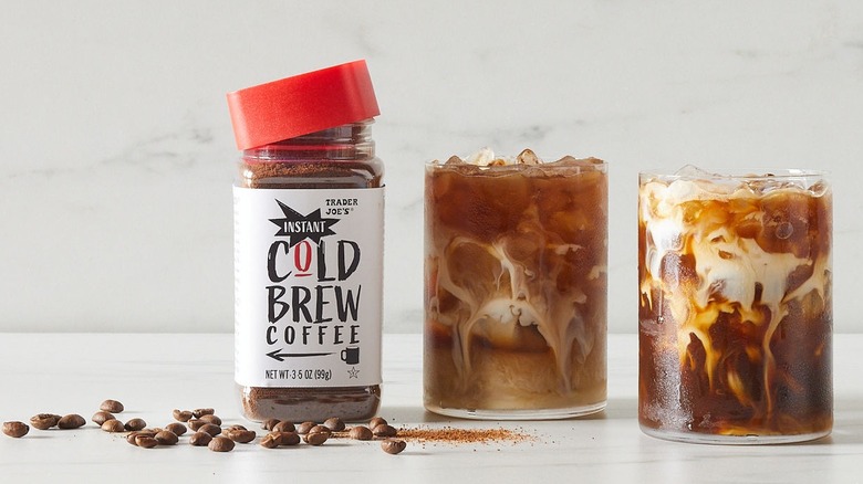 Bottle of Trader Joe's instant cold brew coffee next to two glasses of coffee.