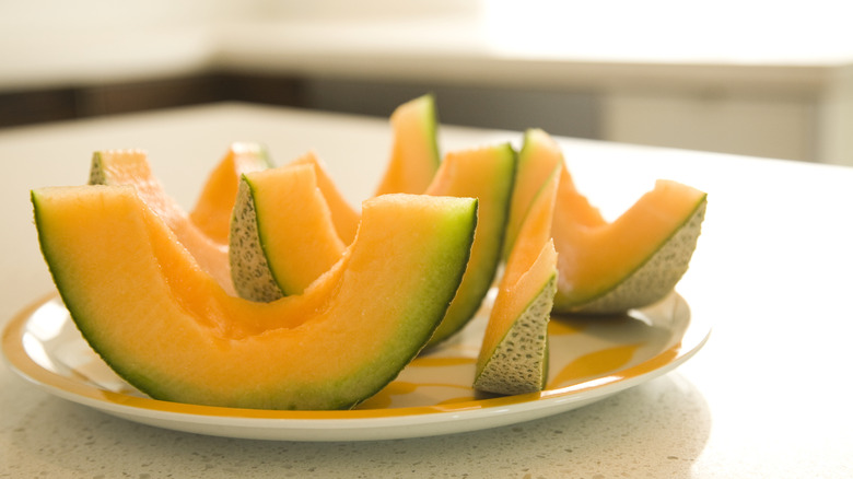 Sliced canteloupe on a plate.