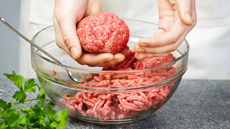 Person shaping ground beef