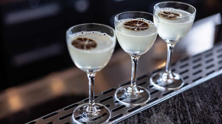 Three Gimlets with lime wheels