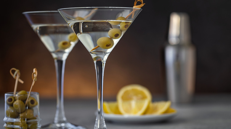 Two martinis with olives