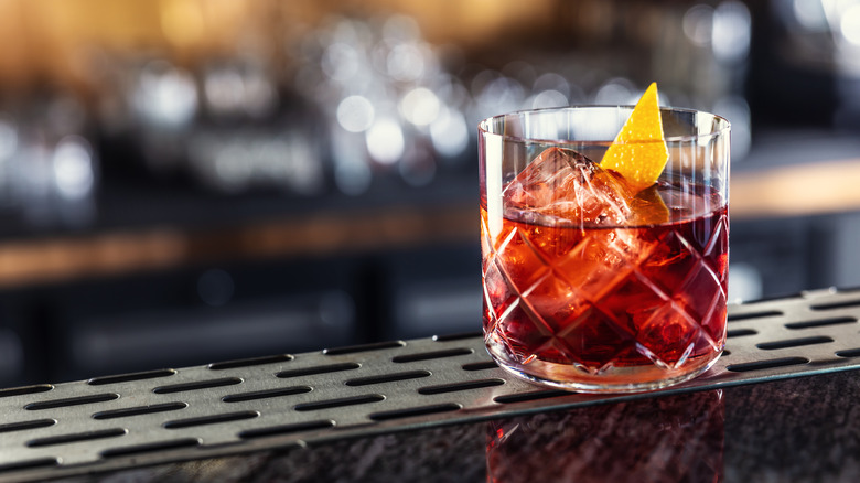 Negroni with orange slice on bar counter