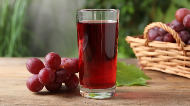 Grape juice glass with grapes