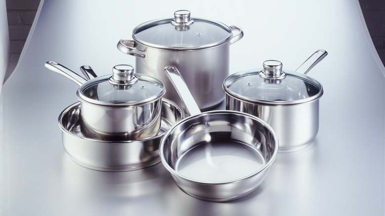 stainless steel pots and pans displayed