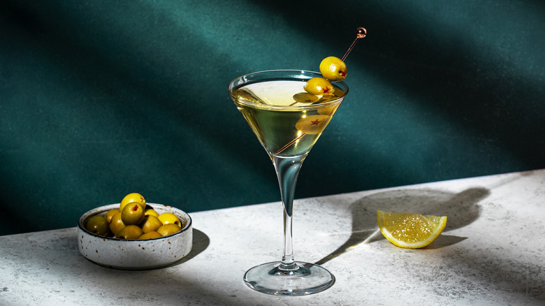 Martini, olives, citrus on table