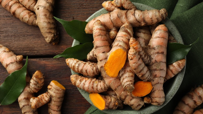 Fresh turmeric pictured on table