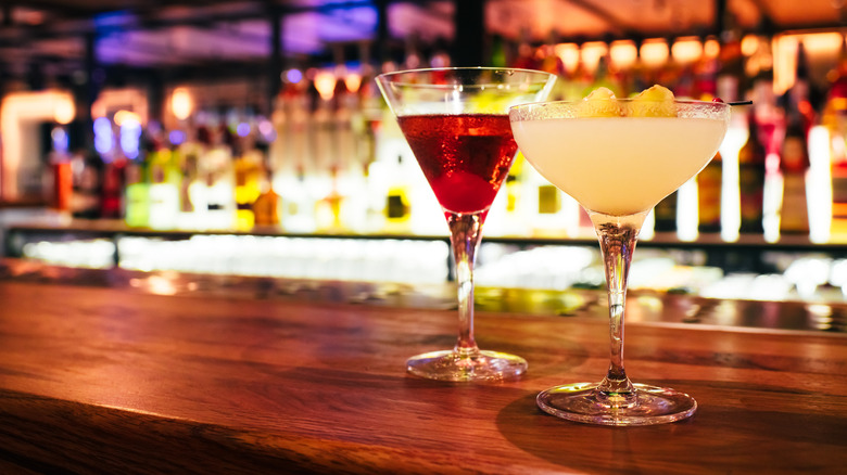 Two cocktails on a bar