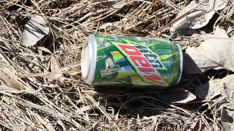 Empty Mountain Dew can thrown on the ground