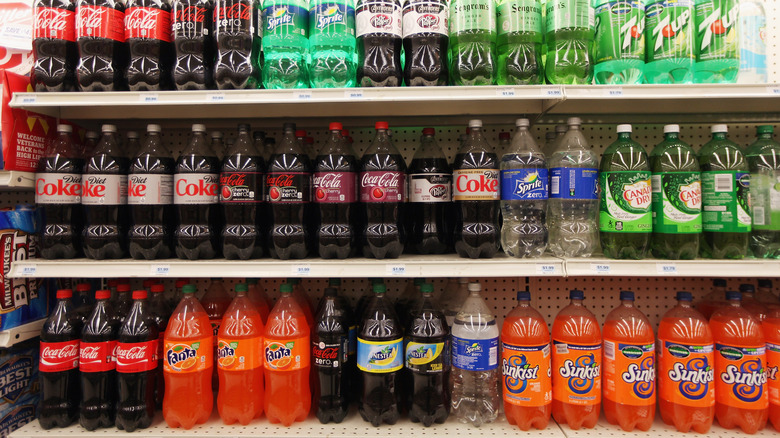 A shelf full of soda