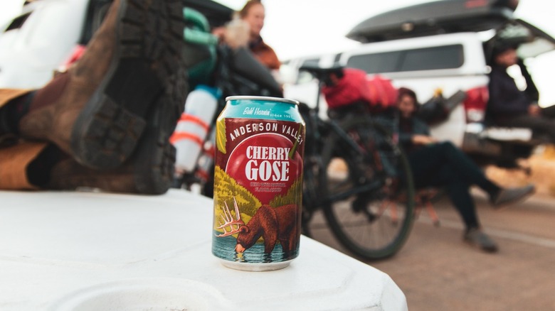 A can of Anderson Valley cherry gose on white cooler with people in the background