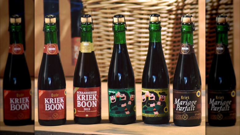 A collection of Boon Brewery beers on a wooden table with a basket in the background