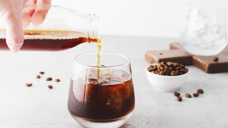 Hand pouring cold brew