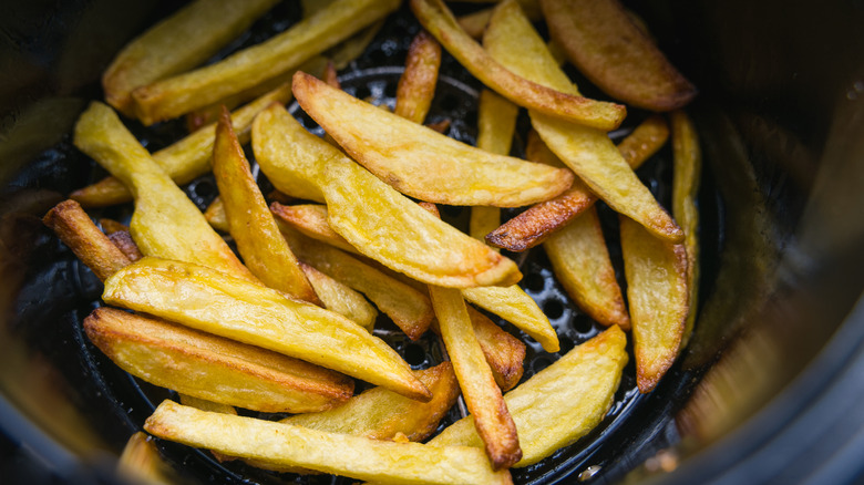Close up of french fries in air fryer basket
