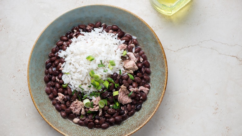 Cuban-style black beans with meat, rice, scallions