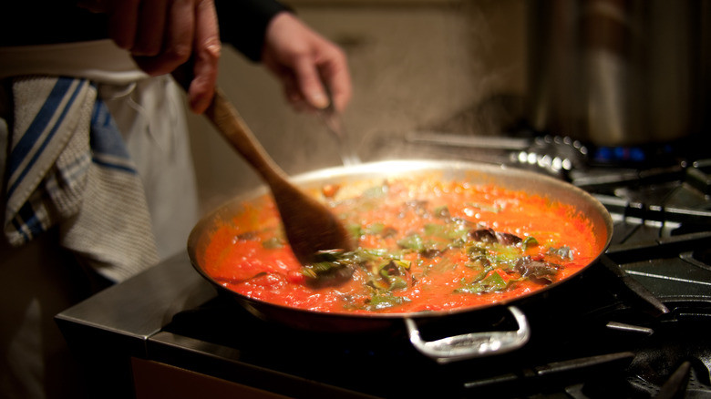 Stirring pasta on the stove
