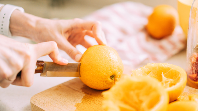 Cutting up oranges