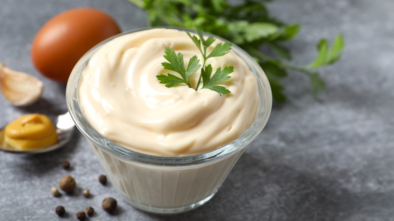 A small glass bowl of mayonnaise