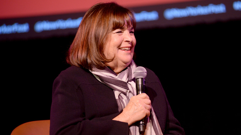 Ina Garten smiling with microphone