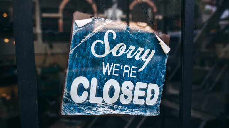 "Sorry we're closed" window sign