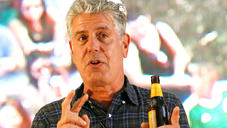 Anthony Bourdain outside of bar