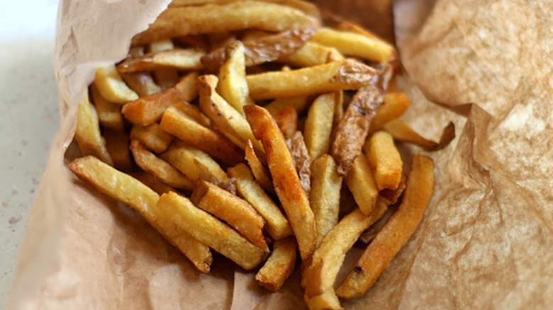 Skin-onn fries in a paper bag