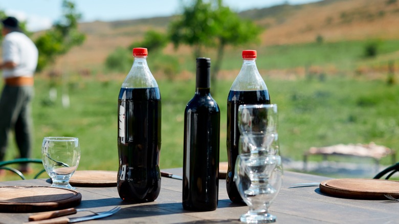 Red wine with cola on table