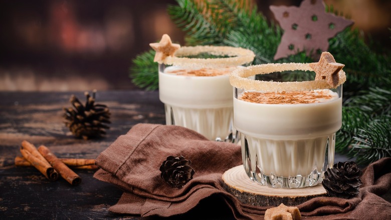 Glasses of eggnog on a decorated table