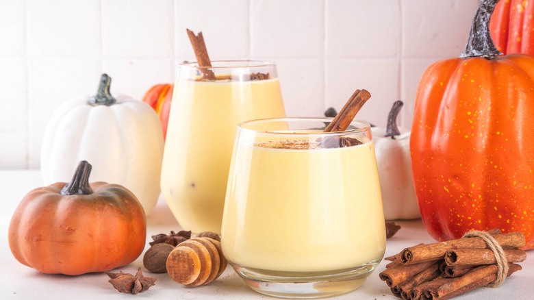 Pumpkin eggnog in glasses on a countertop