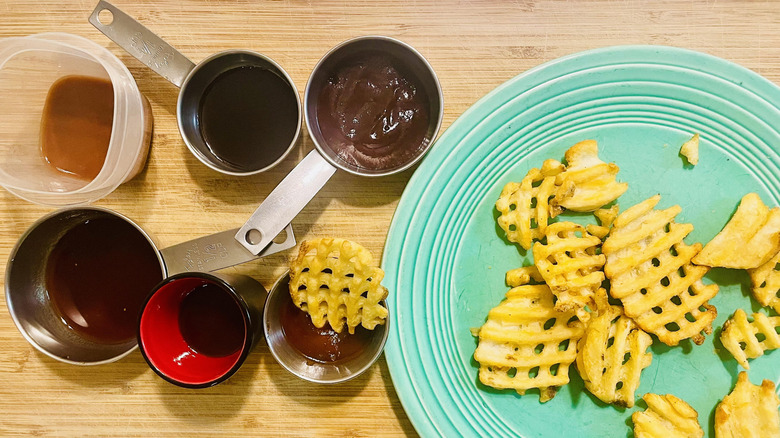 Fries and various barbecue sauces