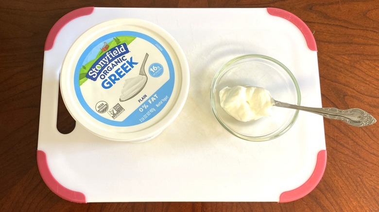 Stonyfield Greek Organic yogurt sits beside a sample