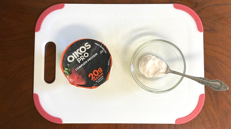 Oikos Pro high-protein yogurt is shown on a table