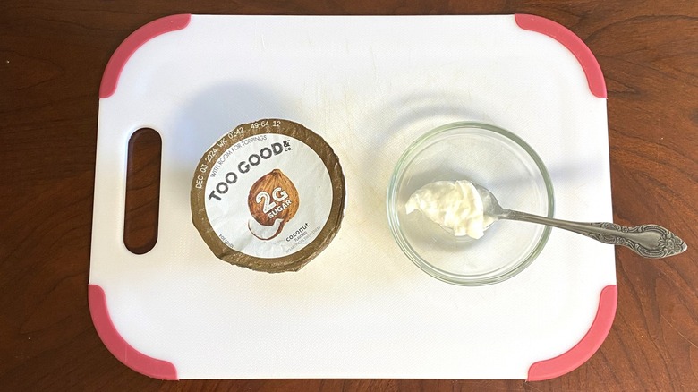 Too Good and Co. high-protein yogurt is displayed beside a sample