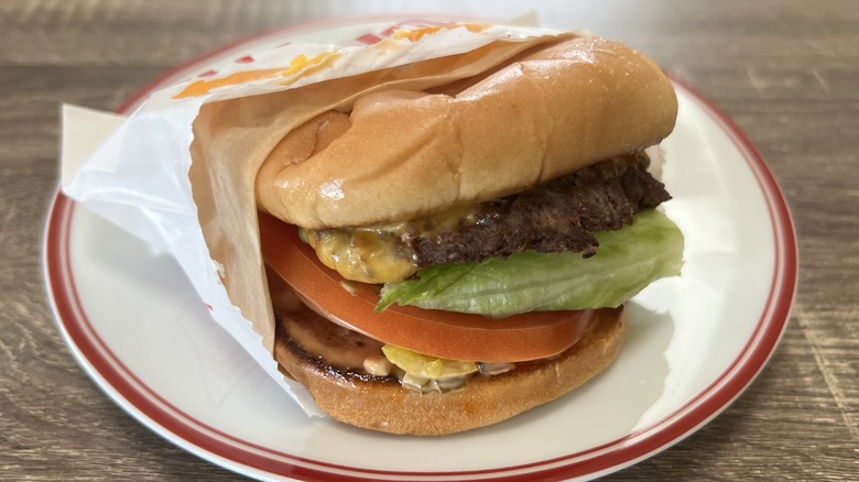 Cheeseburger with chopped chilis