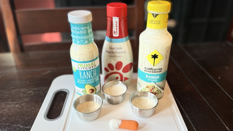 three bottles of dressing with samples