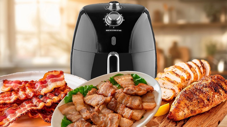 Various meats surrounding air fryer