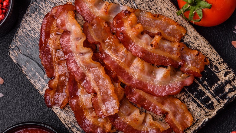 Crispy bacon on black slate