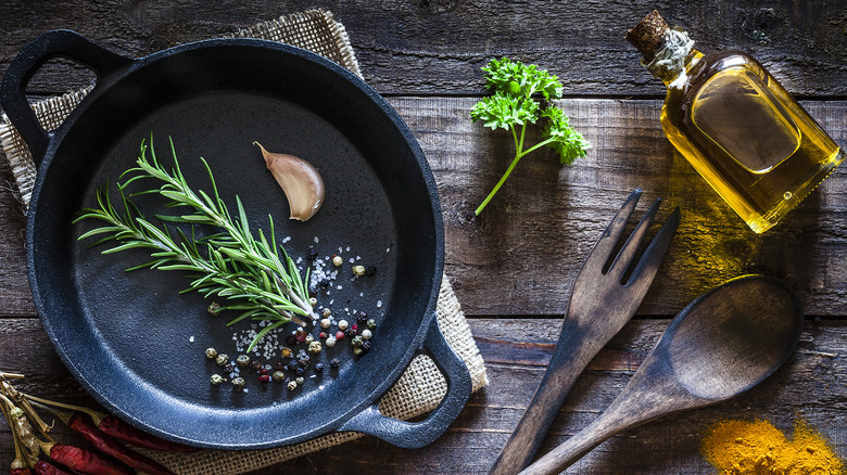 cast iron pan with garlic herbs oil