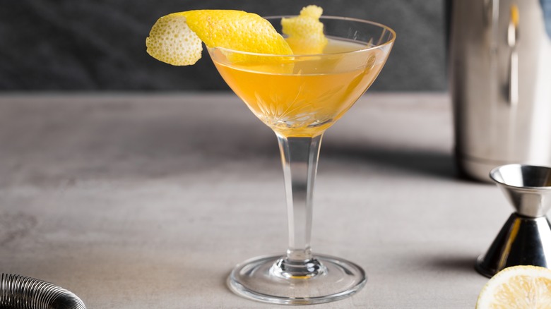 Sidecar cocktail with lemon twist