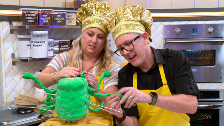 Nailed It contestants attempt to build a dessert