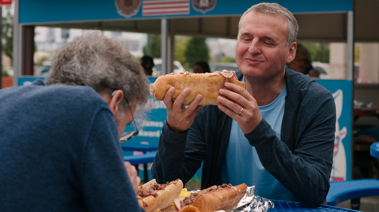 Phil Rosenthal eating in his Netflix series