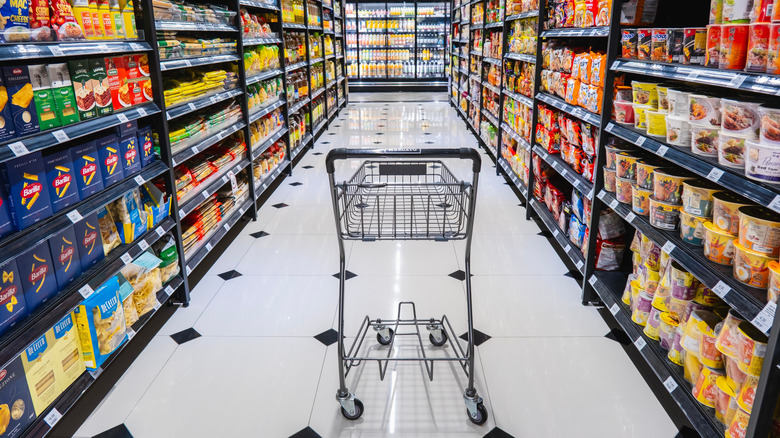 Shopping cart in grocery aisle